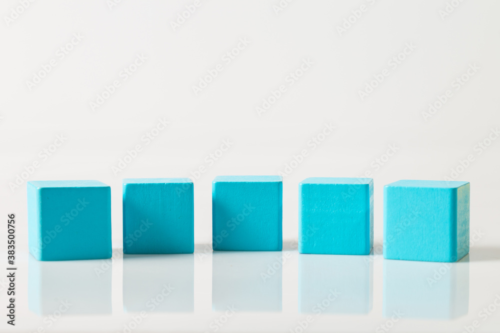 blue wooden geometric shapes cube isolated on a white background blue wooden geometric shapes cube isolated on a white background
