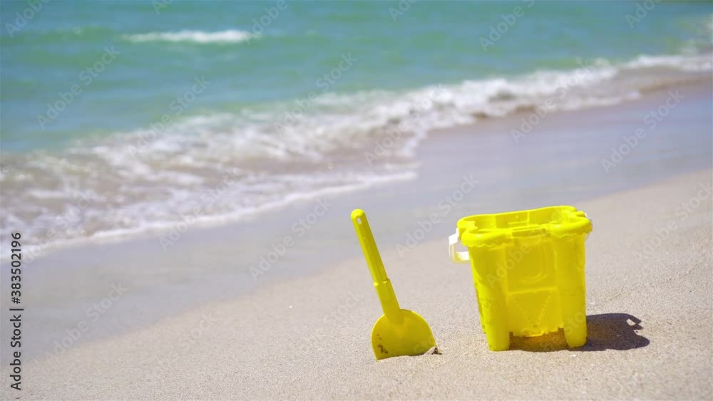 Beach kid's toys on white sand beach Beach kid's toys on white sand beach