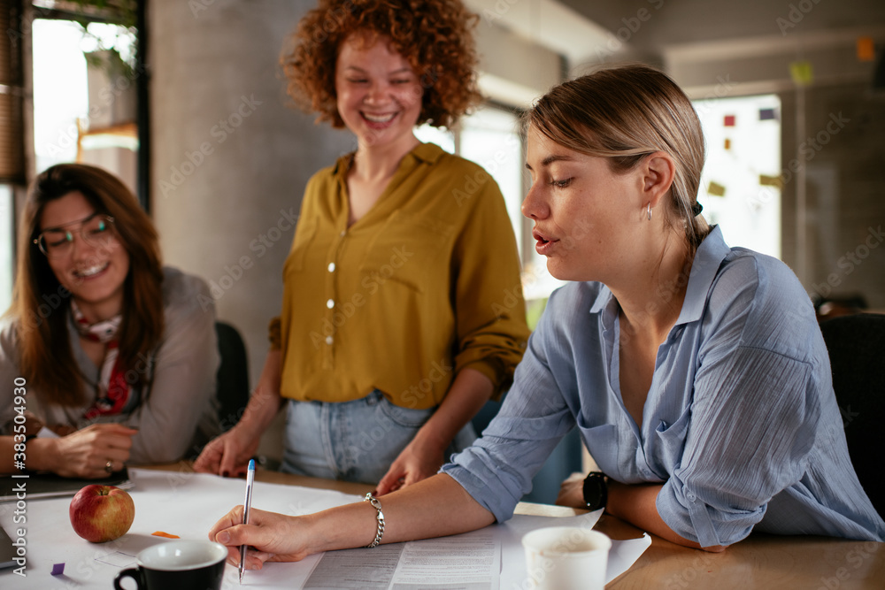 Businesswomen working on a new project. Colleagues discussing about problem they have to solved.. Businesswomen working on a new project. Colleagues discussing about problem they have to solved..