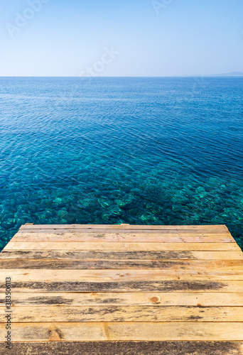 Empty wooden pier and sea
