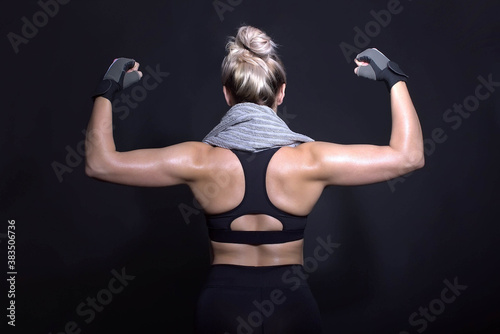 blond woman muscular back fitness