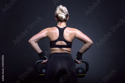 blond woman muscular back fitness