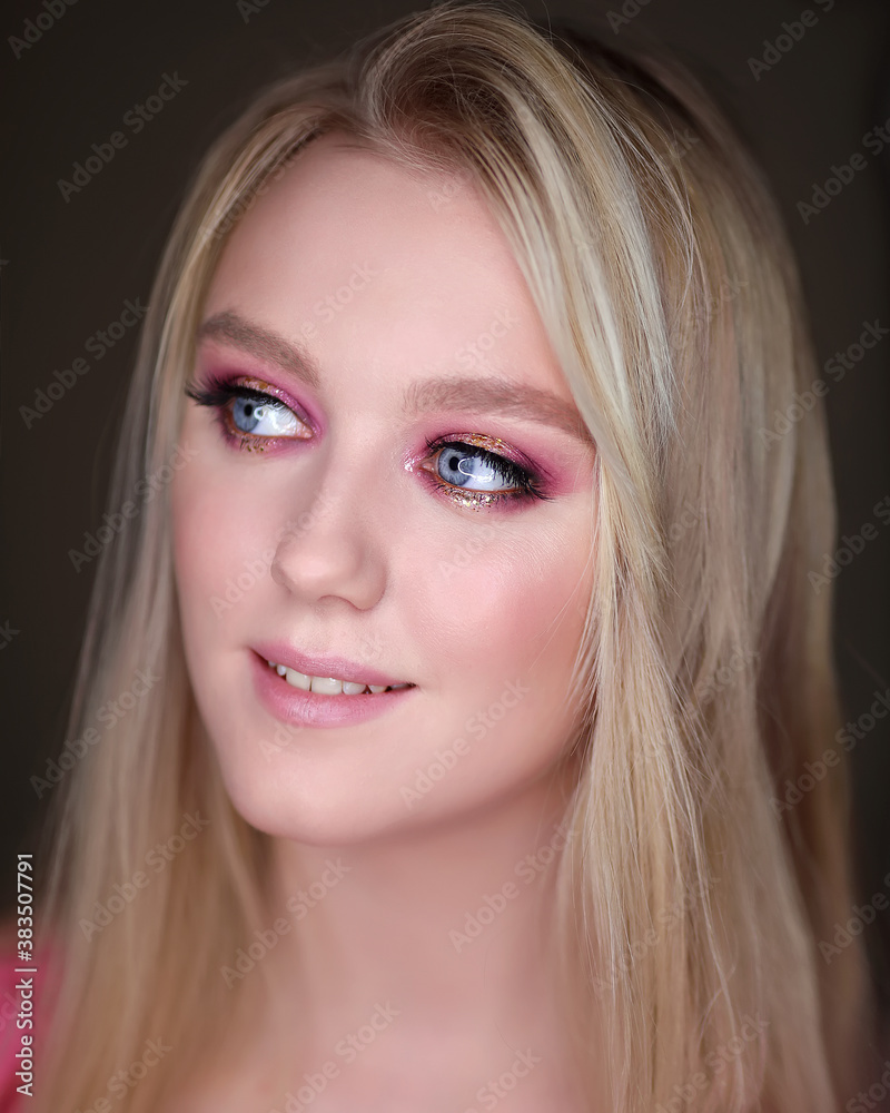 Close-up portrait of a girl with pink makeup. Close-up portrait of a girl with pink makeup.