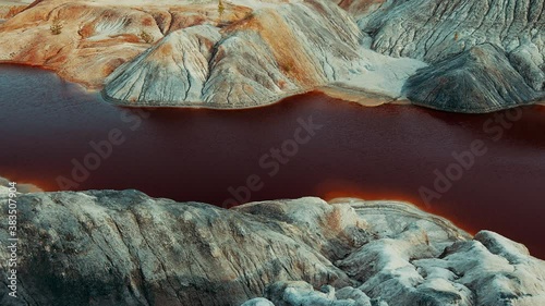 Martian landscape career in the Ural mountains. Bloody river. Fantastic view. The video can be used in cinema, reportage shooting, as a footage, in a music video