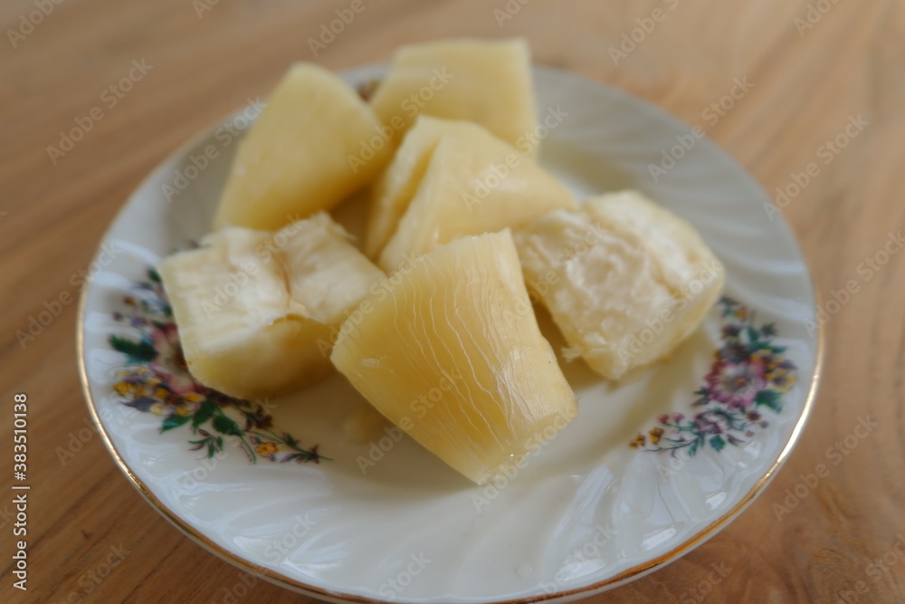 Steamed cassava served on a plate