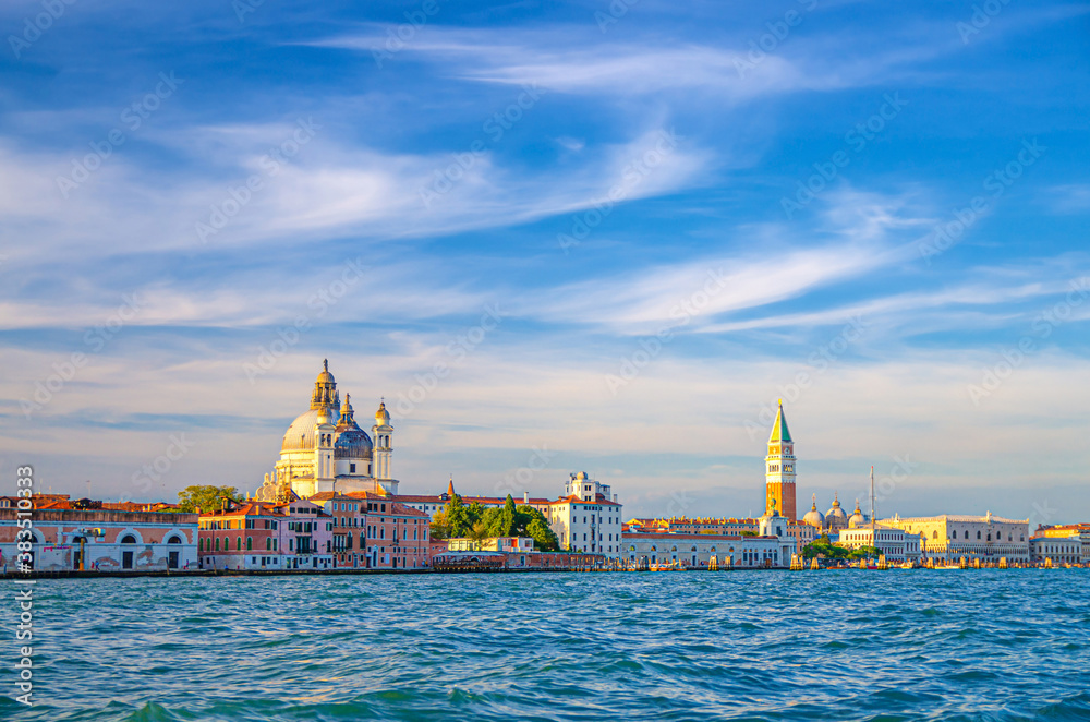 Venice cityscape with San Marco basin of Venetian lagoon water, Santa Maria della Salute church, Campanile bell tower and Doge's Palace Palazzo Ducale building, Veneto Region, Italy