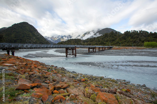 The Waiho River Bridge is located south of Franz Josef township on the Fox Glacier Highway. It was washed away during a storm in March 2019. A Bailey bridge is a type of pre-fabricated truss bridge. photo