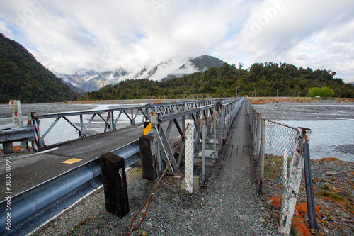 The Waiho River Bridge is located south of Franz Josef township on the Fox Glacier Highway. It was washed away during a storm in March 2019. A Bailey bridge is a type of pre-fabricated truss bridge. photo