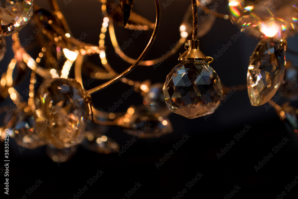 Close-up modern crystal chandelier. Glamorous background with copy spaces. Selective soft focus. Close-up modern crystal chandelier. Glamorous background with copy spaces. Selective soft focus.