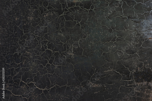 black cracked old paint texture abstract vintage background with cracked cobwebs