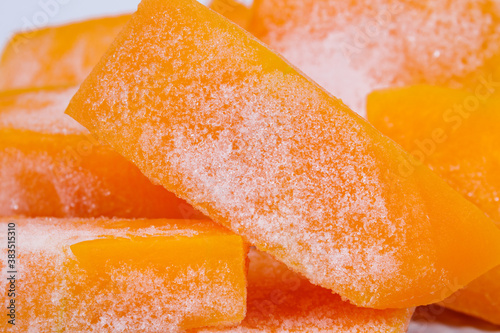 Frozen pieces of pumpkin. Macro shot.