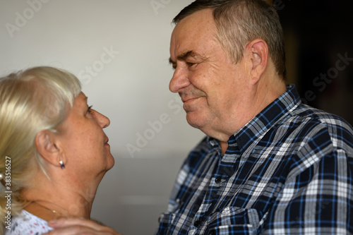 Seniors couple portrait on at home.