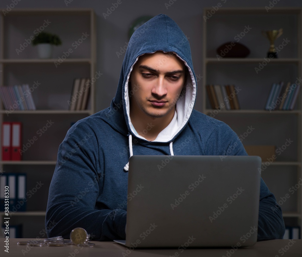 Hacker hacking the data late at night Hacker hacking the data late at night