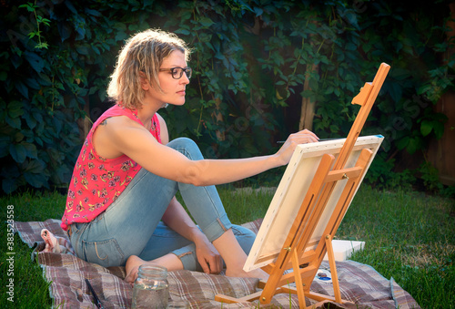 woman artist working on a painting