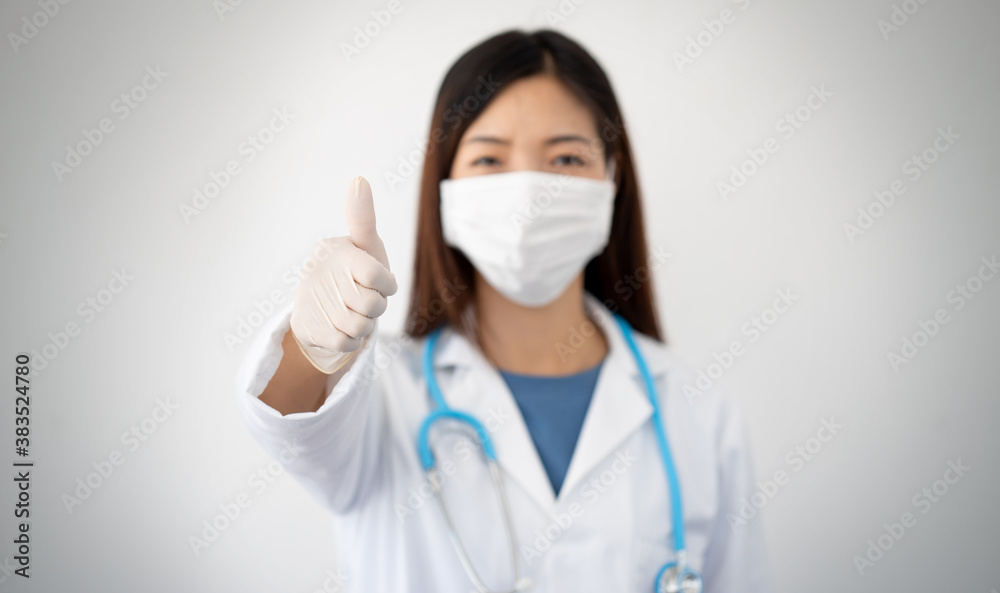 doctor with lab coat and stethoscope during the coronavirus pandemic is optimistic doctor with lab coat and stethoscope during the coronavirus pandemic is optimistic