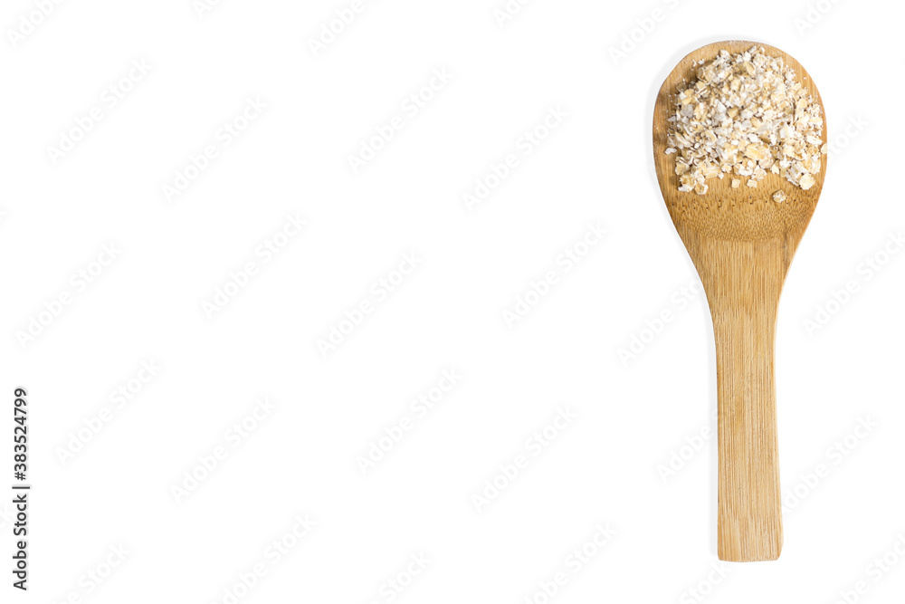 Wooden spoon filled with oats isolated on white background