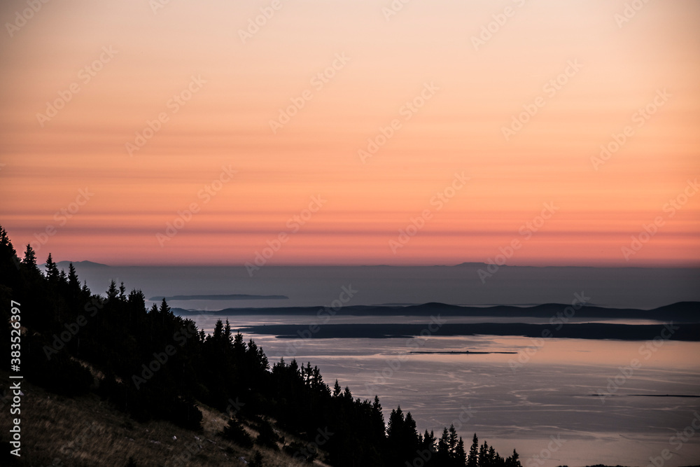 ZAVIZAN, CROATIA, SEPTEMBER 2020 - Hill slope of Zavizanska kosa and sunset above the Adriatic  sea and islands.