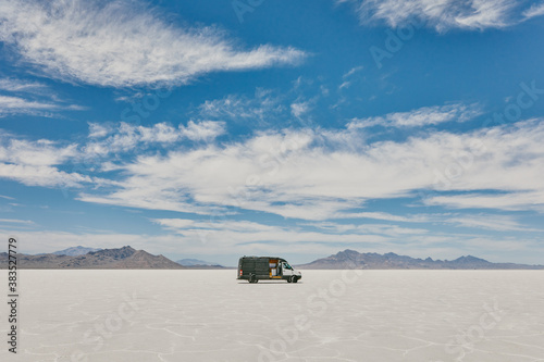 Camper van on Bonneville Salt Flats in Utah during a summer road trip.