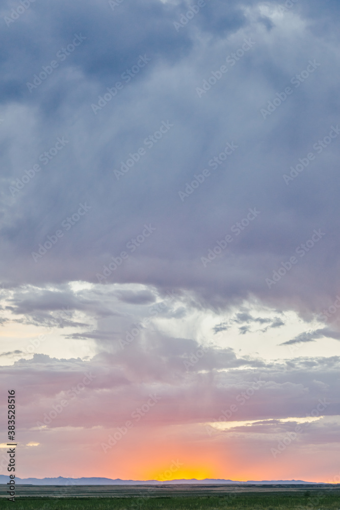 Glowing sunset touching horizon line over field in Meadow, Utah. Glowing sunset touching horizon line over field in Meadow, Utah.