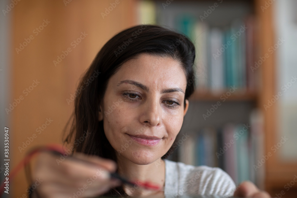 student female with tools in a library doing a try student female with tools in a library doing a try