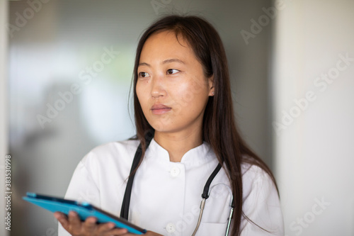 young asia female doctor woman with report in a practice