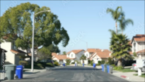 Wallpaper Mural Suburb real estate, property in residential district, San Diego county, California USA. Defocused typical suburban neighborhood. Detached single-family houses, expensive realty. Row of classic homes. Torontodigital.ca
