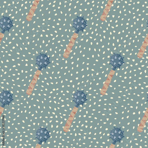 Pastel palette seamless doodle pattern with stylized flail mace shapes. Blue and beige colored weapon on green dotted background.
