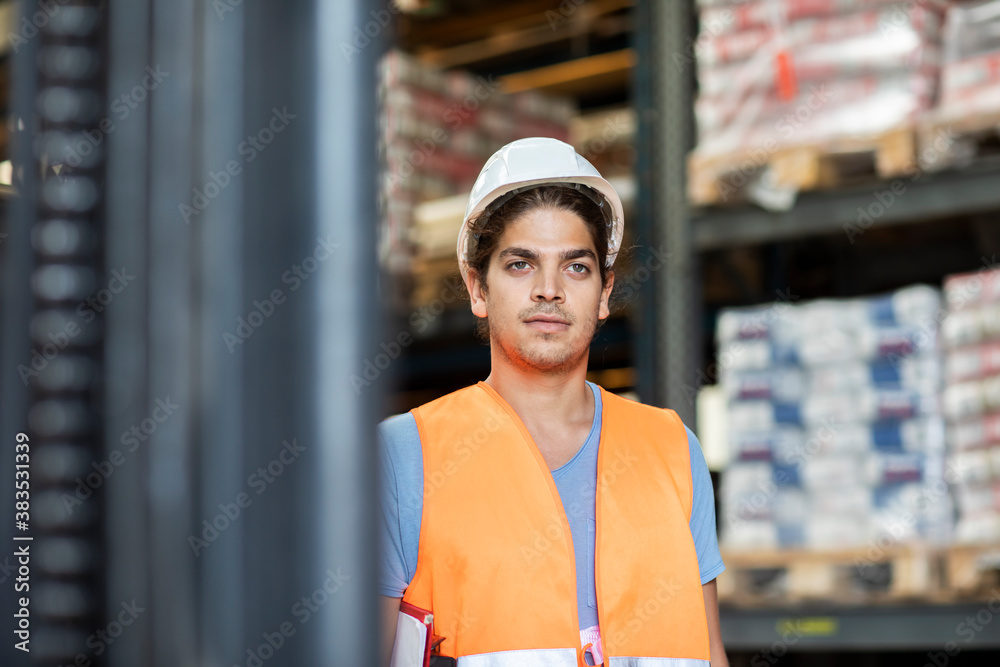 young store worker with helmet working in a store young store worker with helmet working in a store
