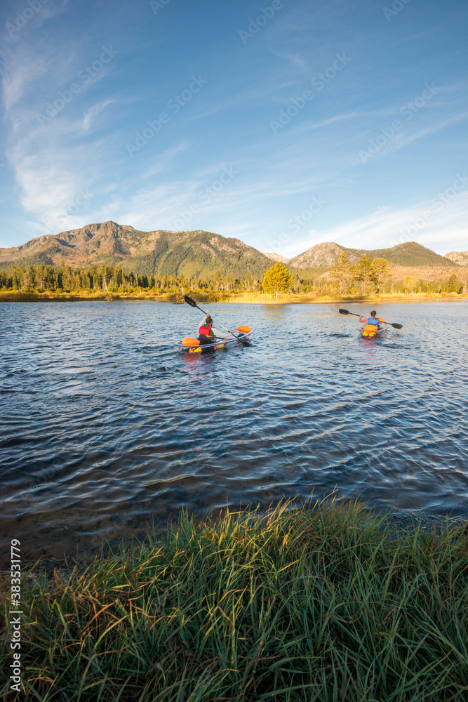 A man and woman kayaking on Lake Tahoe, CA A man and woman kayaking on Lake Tahoe, CA