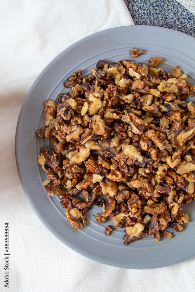 walnuts in a plate on the table walnuts in a plate on the table