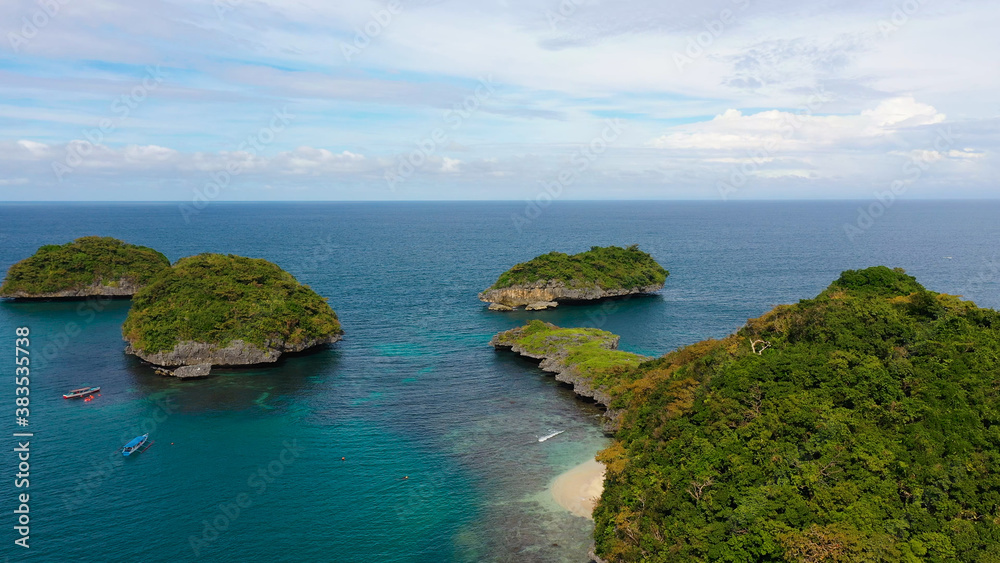Top view of the beautiful Islands with lagoons and beaches in the hundred Islands national Park, Pangasinan, Philippines. Summer and travel vacation concept