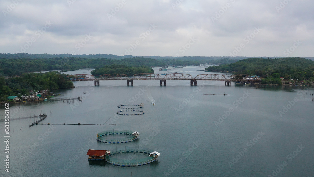 Obraz premium Aerial view of fish ponds for bangus, milkfish. Fish farm, top view. large scale traditional floating fish farms.