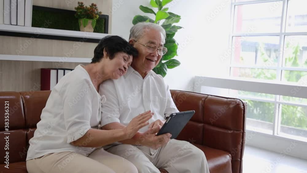 Couple Senior of asian wife and husband use video call to nephew with happy smiling face. Social distancing. Couple Senior of asian wife and husband use video call to nephew with happy smiling face. Social distancing.