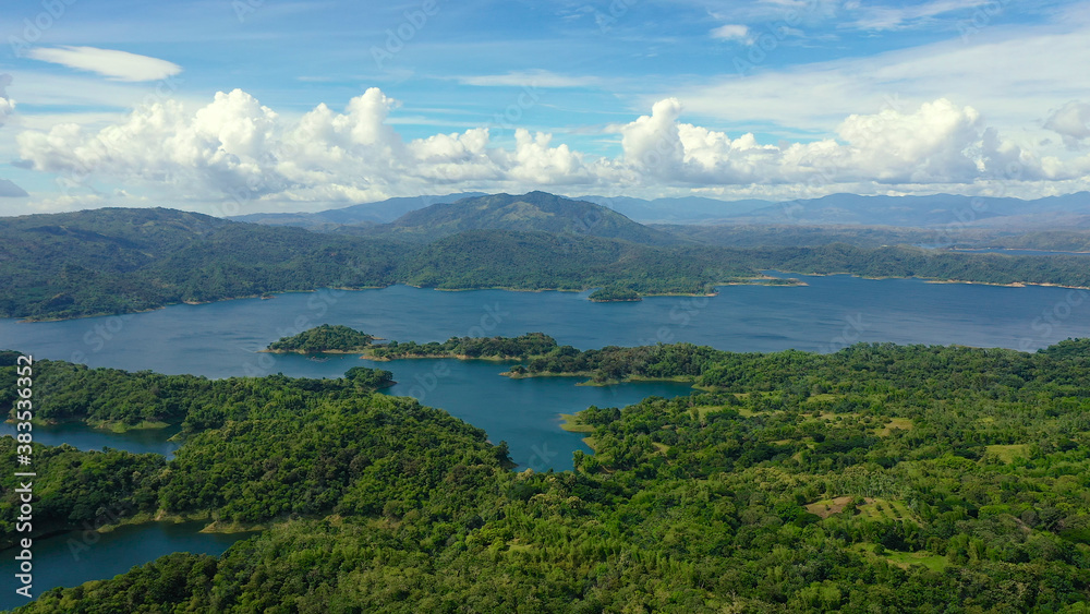 Beautiful landscape with green hills, top view. Azure Pantabangan lake among the hills. Lake in the mountains. Philippines, Luzon.