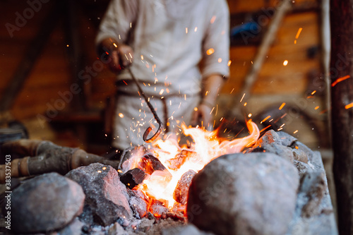 Canvas Print Fire crackling in blacksmith workshop of forging metal