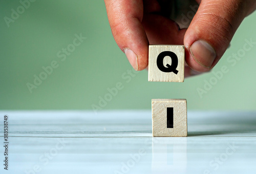 IQ word concept on wooden cube. Intelligence symbol. Brain or talent background idea
