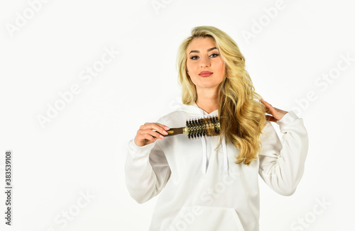 Easy hairdo. Beauty supplies. Use with hairdryer to create styling. Hot curling brush. Pretty woman brushing hair isolated on white. Long hair. Hair care. Hairdresser salon. Professional equipment