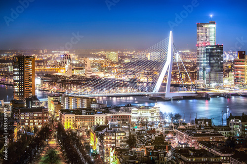 Rotterdam skyline with the Erasmus bridge at night seen from the Euromast tower, Netherlands.