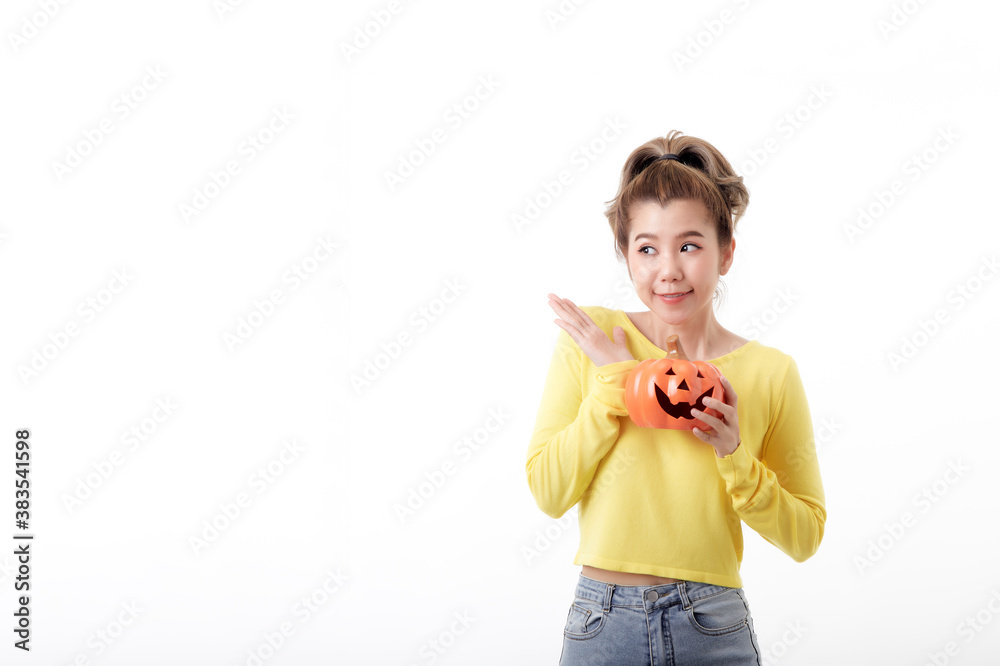 Young woman holding a pumpkin in halloween on white Young woman holding a pumpkin in halloween on white