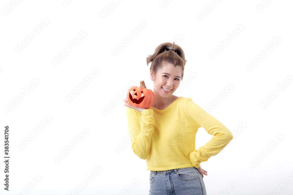 Young woman holding a pumpkin in halloween on white Young woman holding a pumpkin in halloween on white
