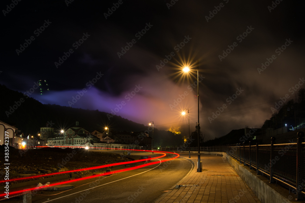 Purple clouds of the night city in Krasnaya Polyana Sochi.