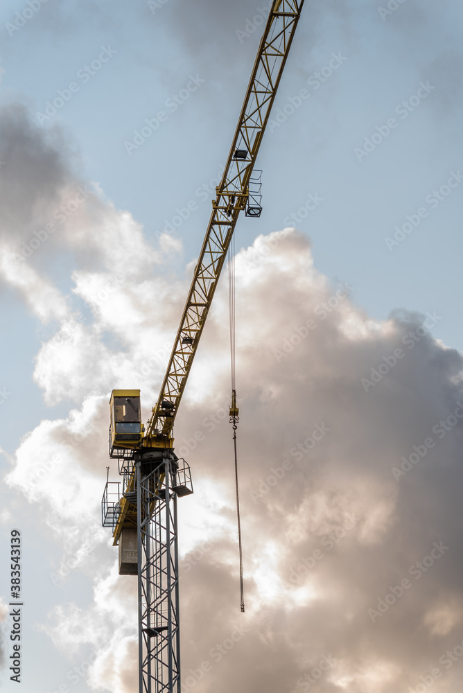 High tower crane for lifting weights. High tower crane for lifting weights.