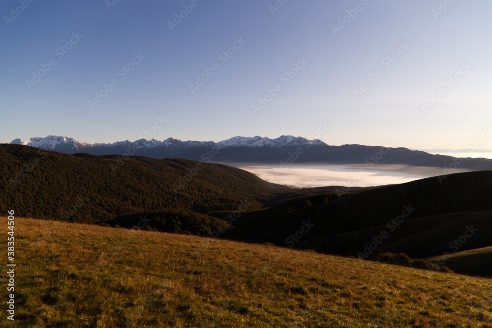 The Cansiglio plateau covered by fog in the morning The Cansiglio plateau covered by fog in the morning