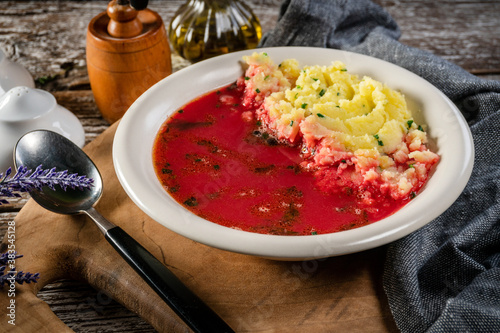 Red borscht soup in bowl. photo