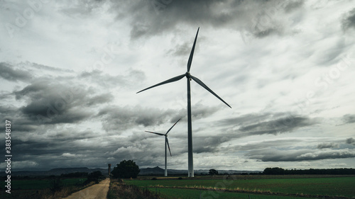 
wind turbine with a cloudy and gray sky, villacidro, south sardinia photo