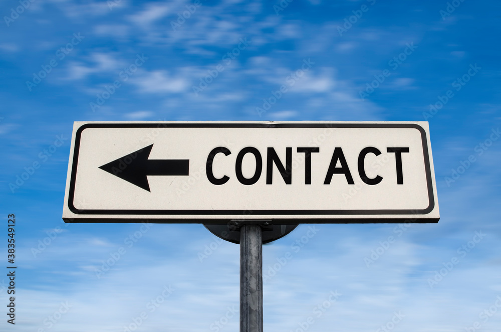Contact road sign, arrow on blue sky background. One way blank road sign with copy space. Arrow on a pole pointing in one direction. Contact road sign, arrow on blue sky background. One way blank road sign with copy space. Arrow on a pole pointing in one direction.