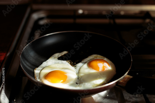 making english breakfast. cooking scrambled eggs.