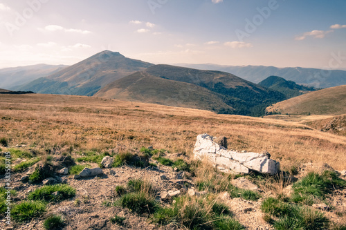 Autumn landscape in the Vulcan Mountain Pass. Alpine scenery with the Straja Peak in the background. Jiu Valley, Romania, Europe.