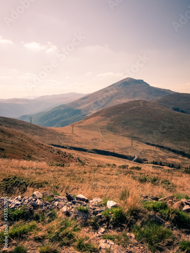 Autumn in the Carpathian wilderness. Natural scene in Pasul Vulcan, with Straja Mountain Peak in the background. Romania, Europe.