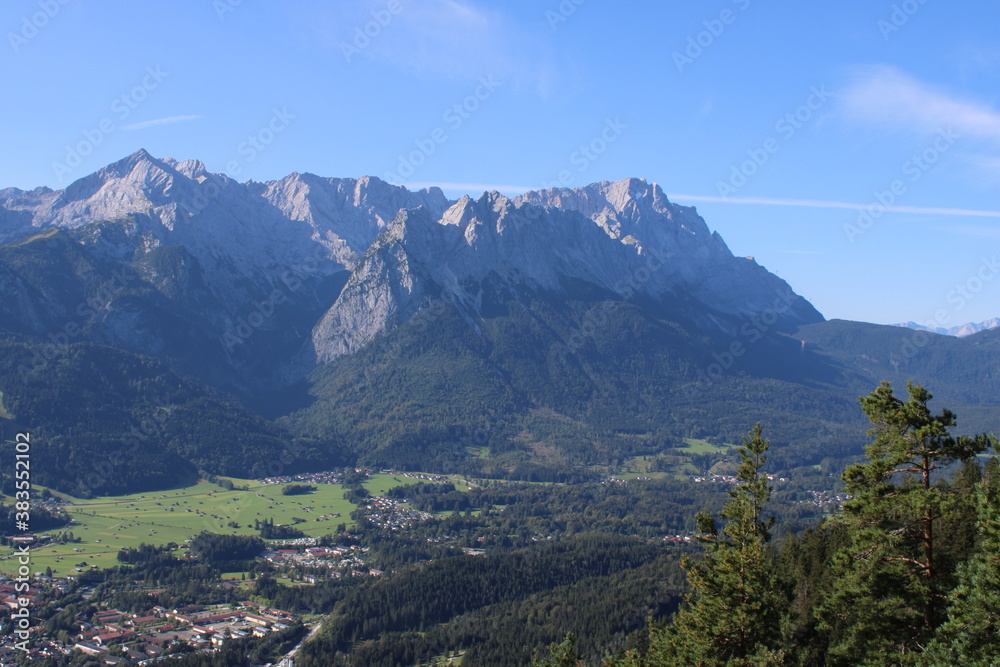 Obraz premium Aerial image of the city of Garmisch-Partenkirchen taken on Kramer Mountain in COVID-19 summer 2020